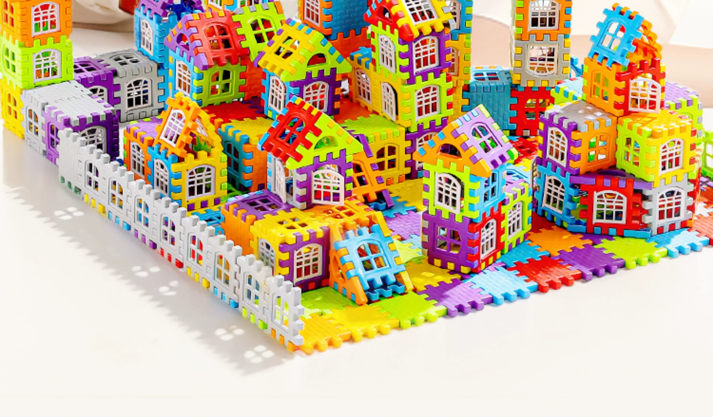Children building houses, assembling puzzle toys with building blocks, to 6-year-old girl and boy big particle blocks, birthday gift puzzle