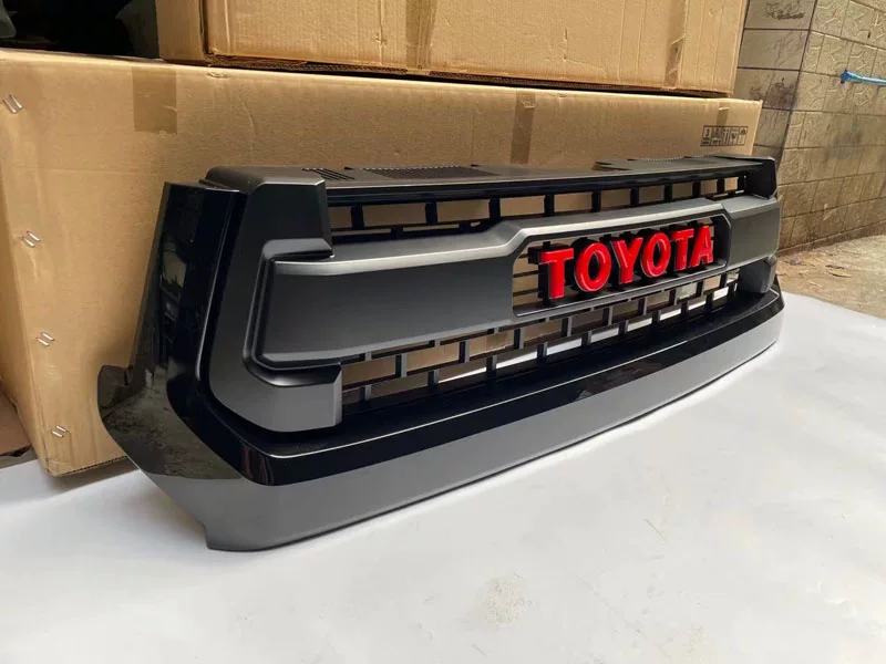 Применимо к 14-21 Toyota Tundra Tantu Trd Front Center Grid Red Большая крышка передней поверхности логотипа маленький желтый свет